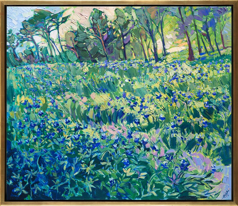 A field of bluebonnets bloom against a spring-green lawn near a grove of pine trees. The famous lupin of Texas blooms with abandon during March and April, bringing visitors from all around to photograph themselves in the lush wildflowers.  This painting captures the bluebonnets near The Woodlands, Texas.</p><p>This painting was done on 1-1/2" canvas, with the painting continued around the edges. The piece has been framed in a gold floater frame and arrives ready to hang.