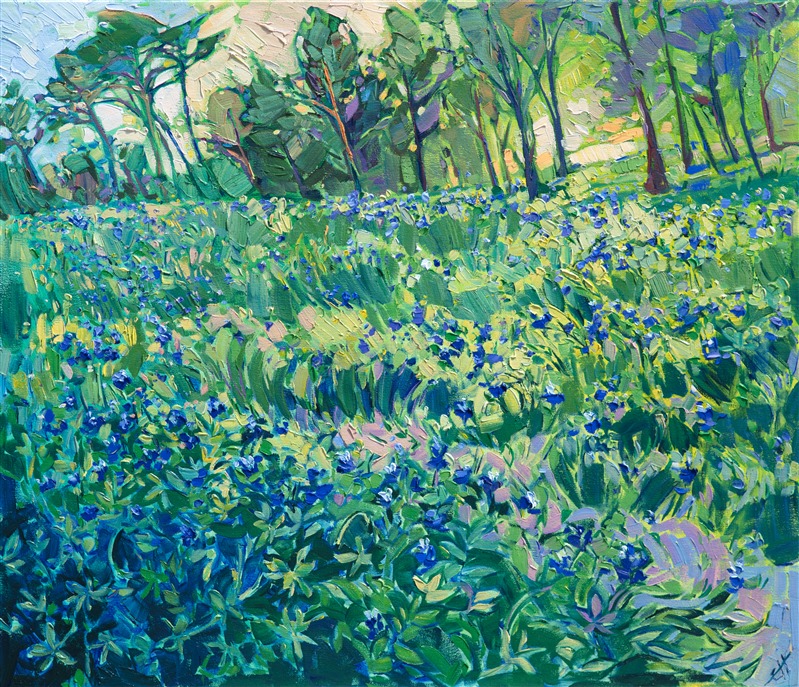 A field of bluebonnets bloom against a spring-green lawn near a grove of pine trees. The famous lupin of Texas blooms with abandon during March and April, bringing visitors from all around to photograph themselves in the lush wildflowers.  This painting captures the bluebonnets near The Woodlands, Texas.</p><p>This painting was done on 1-1/2" canvas, with the painting continued around the edges. The piece has been framed in a gold floater frame and arrives ready to hang.