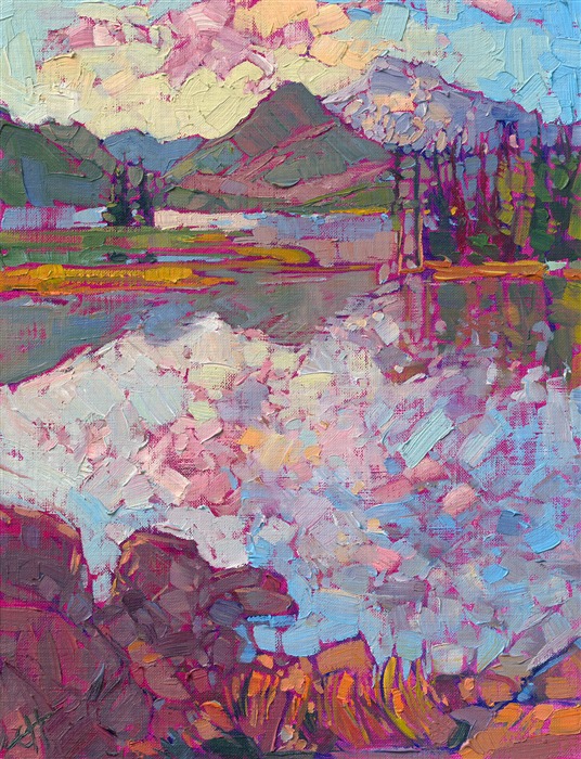 The Oregon Cascades are beautiful in the summer when the range is transformed into a green, idyllic landscape of mountains, lakes, and reflected sunsets. This classic petite is being sold on consignment through The Erin Hanson Gallery.</p><p>"The Cascades" is an original oil painting on canvas board. The piece arrives framed in a black and gold plein air frame, ready to hang.
