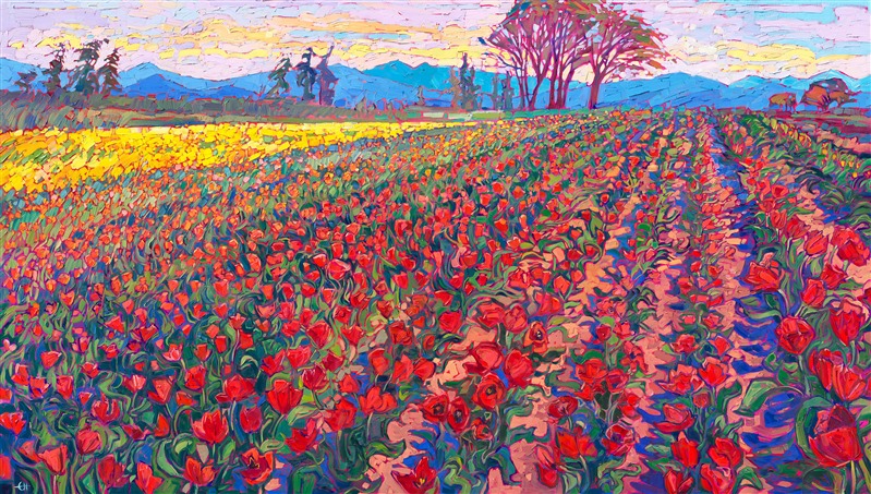 Nestled in the heart of Oregon wine country, Woodburn showcases hundreds of acres of tulip fields. The multi-colored blooms catch the light of the setting sun, glowing in a myriad of rainbow colors. This large-scale oil painting captures the grandeur and beauty of the transient colors of spring in the Willamette Valley.</p><p>"Tulip Blooms" was created on 1-1/2" canvas, and the painting arrives framed in a contemporary gold floater frame finished in 23kt gold leaf. The impressionistic brush strokes are laid side-by-side, without layering, which creates an impressive depth and impasto quality to the painting, and the piece seems to glow from behind like stained glass.