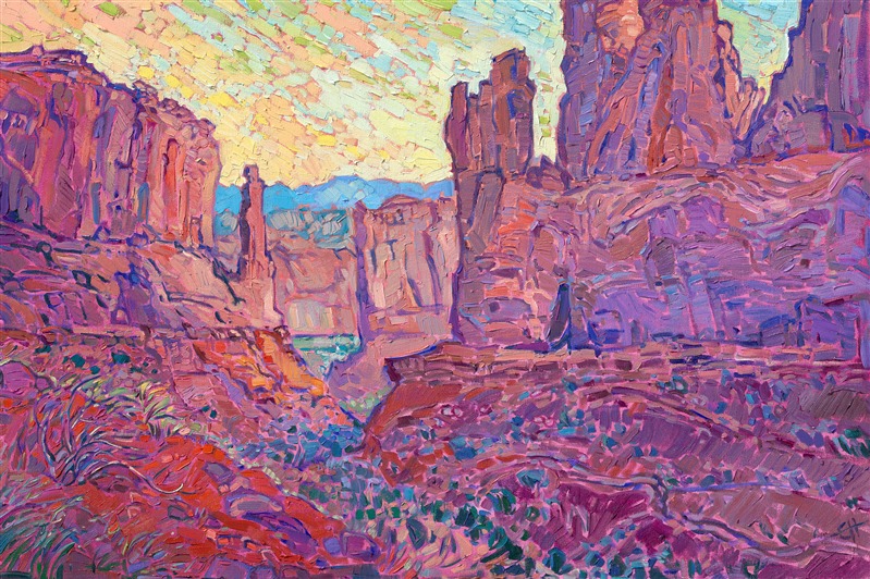 When you first enter Arches National Park, one of my favorite vistas to paint is immediately to your left-hand side. You can see beautiful fins of red rock sandstone overlapping into the far distance. It is most beautiful at dawn. This painting captures the scene with luscious colors of pink and orange.

This painting was exhibited at <i>Erin Hanson: Landscapes of the West </i> solo museum exhibition at the Sears Art Museum in St. George, Utah.
