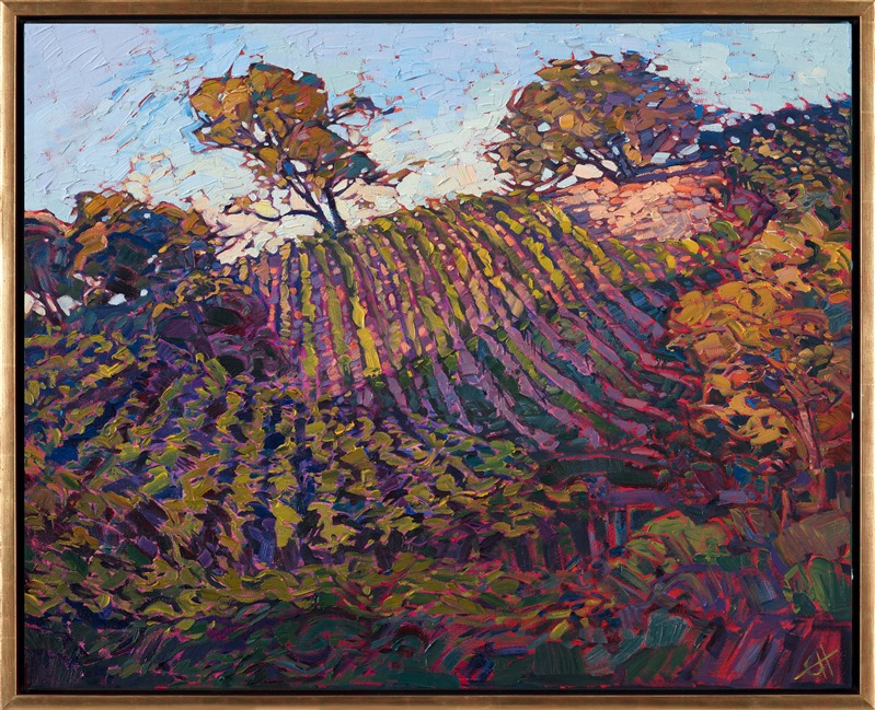 Rows of vineyards sparkle with color on the rolling hills of Paso Robles. The pinot vines are warm with late afternoon light, beckoning you to spend a day relaxing among the vineyards. The brush strokes are loose and impressionistic, capturing a fleeting memory of time.</p><p>This painting was done on 1-1/2" canvas, with the painting continued around the edges. The piece has been framed in a gold floater frame and arrives ready to hang.