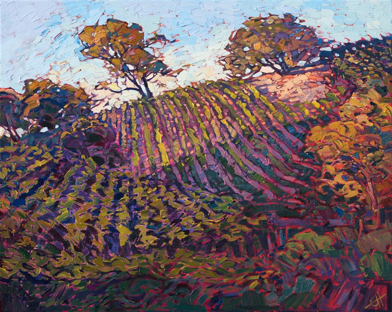 Rows of vineyards sparkle with color on the rolling hills of Paso Robles. The pinot vines are warm with late afternoon light, beckoning you to spend a day relaxing among the vineyards. The brush strokes are loose and impressionistic, capturing a fleeting memory of time.</p><p>This painting was done on 1-1/2" canvas, with the painting continued around the edges. The piece has been framed in a gold floater frame and arrives ready to hang.