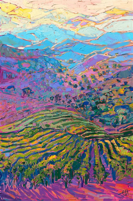 From the heights of Peachy Canyon Vineyards, you can see miles and miles in every direction, in Paso Robles, California. The fading layers of hills catch the late afternoon light, glowing with hues of green and gold. The brush strokes in this oil painting are thick and impressionistic, creating a mosaic of color and texture across the canvas.</p><p>"Vineyard Hills" was created on 1-1/2" canvas, and the painting arrives framed in a contemporary gold floater frame, ready to hang.