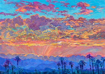 Dramatic clouds blossom with color above Palm Springs, the rays of the sun casting glimmers of yellow and gold among the mauve shadows within the clouds. The background mountains appear blue in the distance, a stark contrast against the sunset sky. The brush strokes are thick and impressionistic, capturing the fleeting beauty of the moment.
