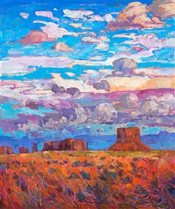 The buttes skirting the edges of Monument Valley are monoliths of beauty in their own right. Their tall, flat planes of color rise starkly from the flat desert floor, which itself is rainbow of color: green and purple shrubs planted against bright orange sands. This painting captures monsoon clouds on a summer day at the four corners region. The brush strokes are thick and impressionistic, creating a mosaic of color and texture across the canvas.

This painting was done on 1-1/2"-deep canvas, with the painting continued around the edges.  <i>Buttes and Sky</i> has been framed in a hand-carved, gold leaf floater frame that was custom-made for this painting.