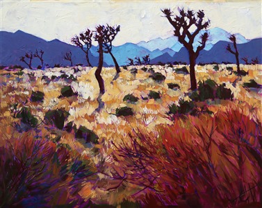 The early morning light at Joshua Tree National Park is reflected off the golden summer desert scrub. The distant mountains are layers of color fading into the distant. Thick layers of paint create a texture that jumps out of the painting.