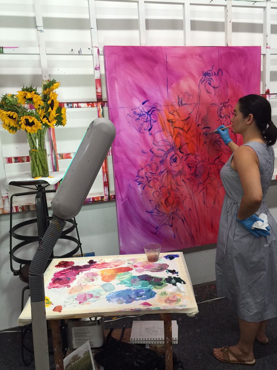 Erin Hanson working on Sunflowers in Vase