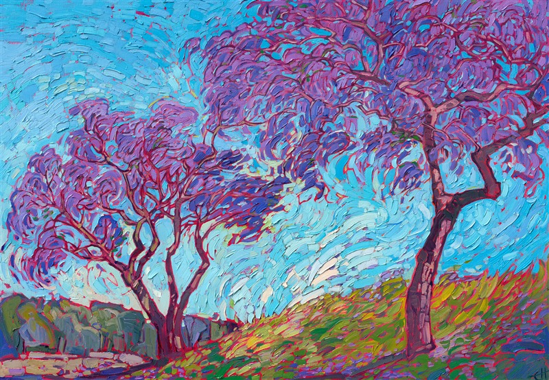 A pair of San Diego jacaranda trees bloom with vivacious color. The bright purple flower petals drift to the ground, creating a carpet of color on the grass. The thickly applied brush strokes of oil stand out from the canvas, adding dimension and movement to the painting.</p><p>"Jacaranda Petals" was created on 1-1/2" stretched canvas, with the painting continued around the edges. The piece arrives framed in a contemporary gold floater frame.
