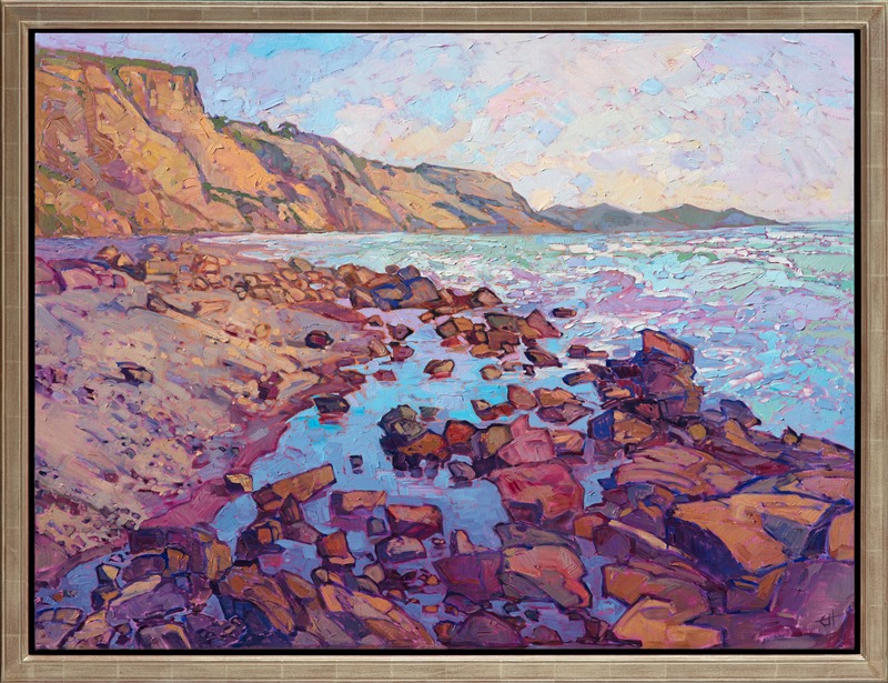 During a coastal hike at Torrey Pines, I discovered a tumble of alizarin-hued boulders scattered into the ocean.  The water was still and reflective within the shelter of the boulders, creating a dramatic vista to paint.</p><p>This painting has been framed in a hand-gilded, carved floater frame that was designed to complement the colors in this painting.  It will arrived wired and ready to hang.<br/>